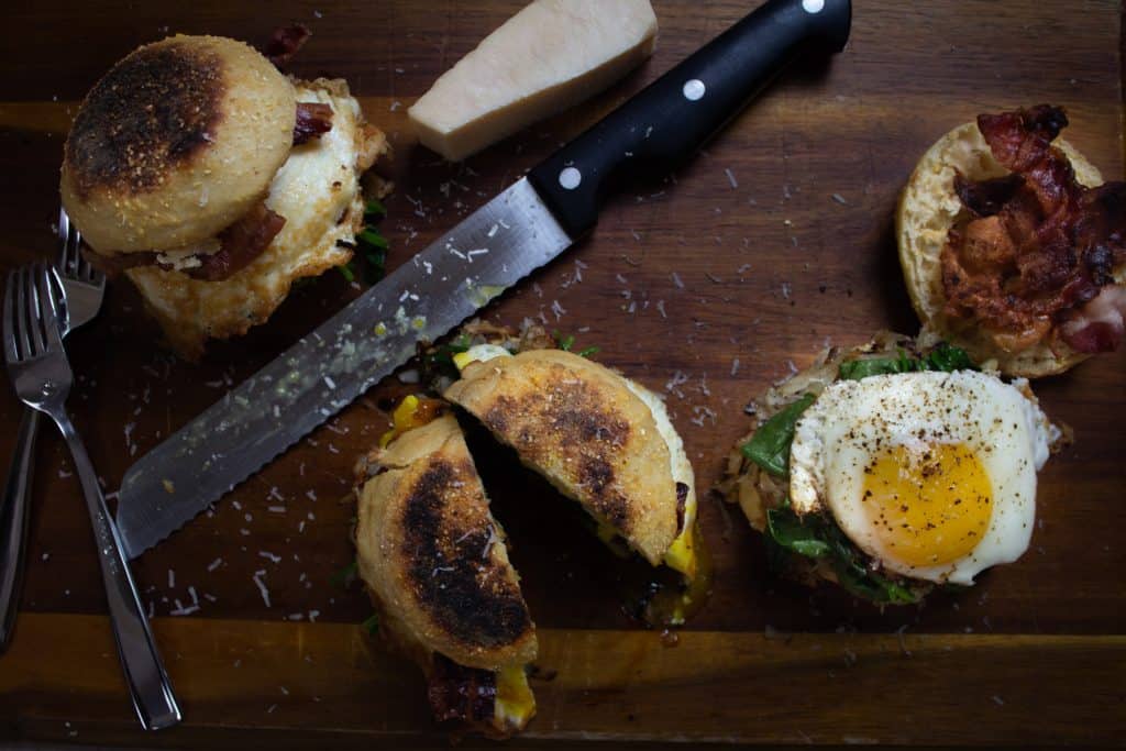 Italian Breakfast sandwiches cut open on cutting board