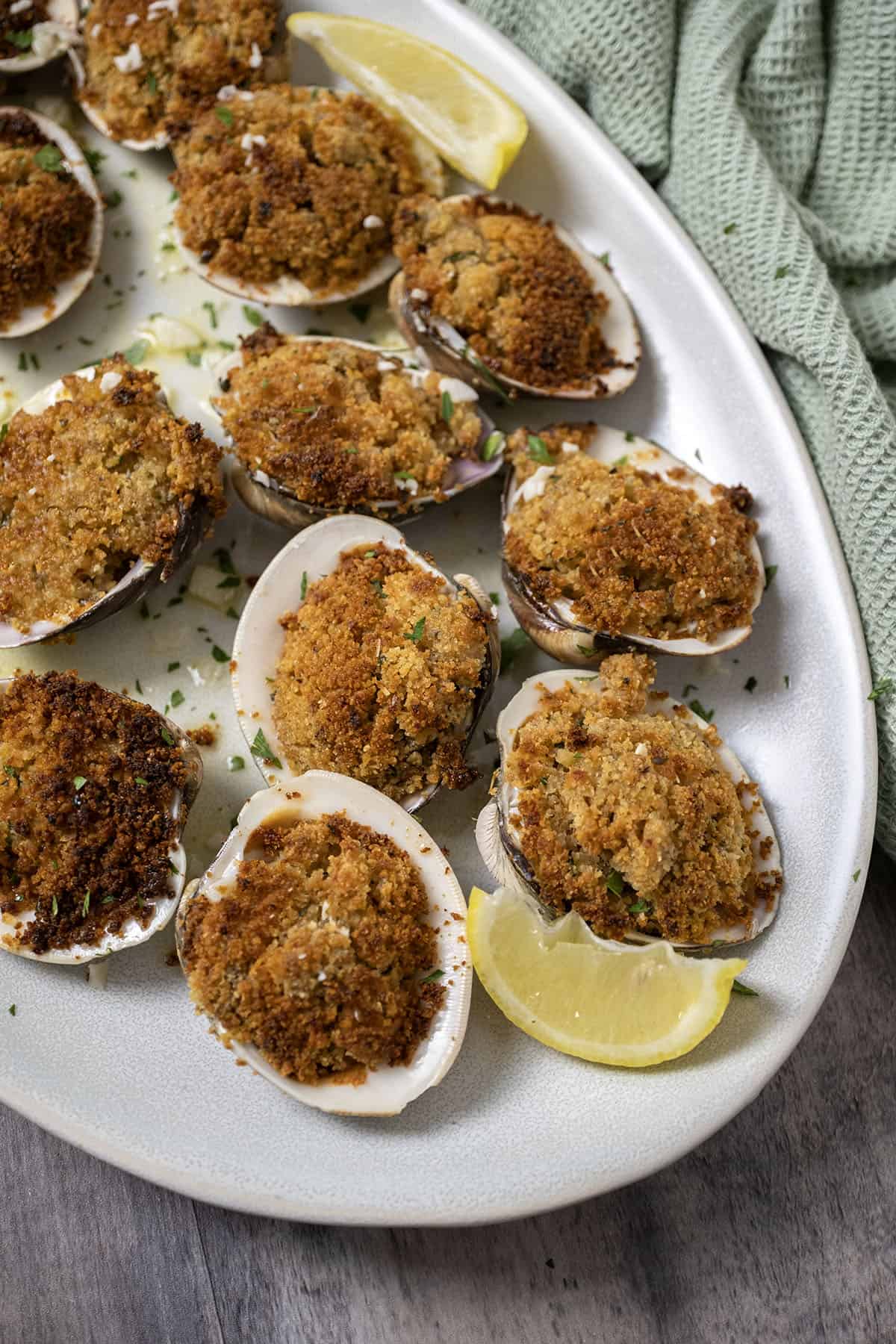 Baked clams over lemon garlic sauce.