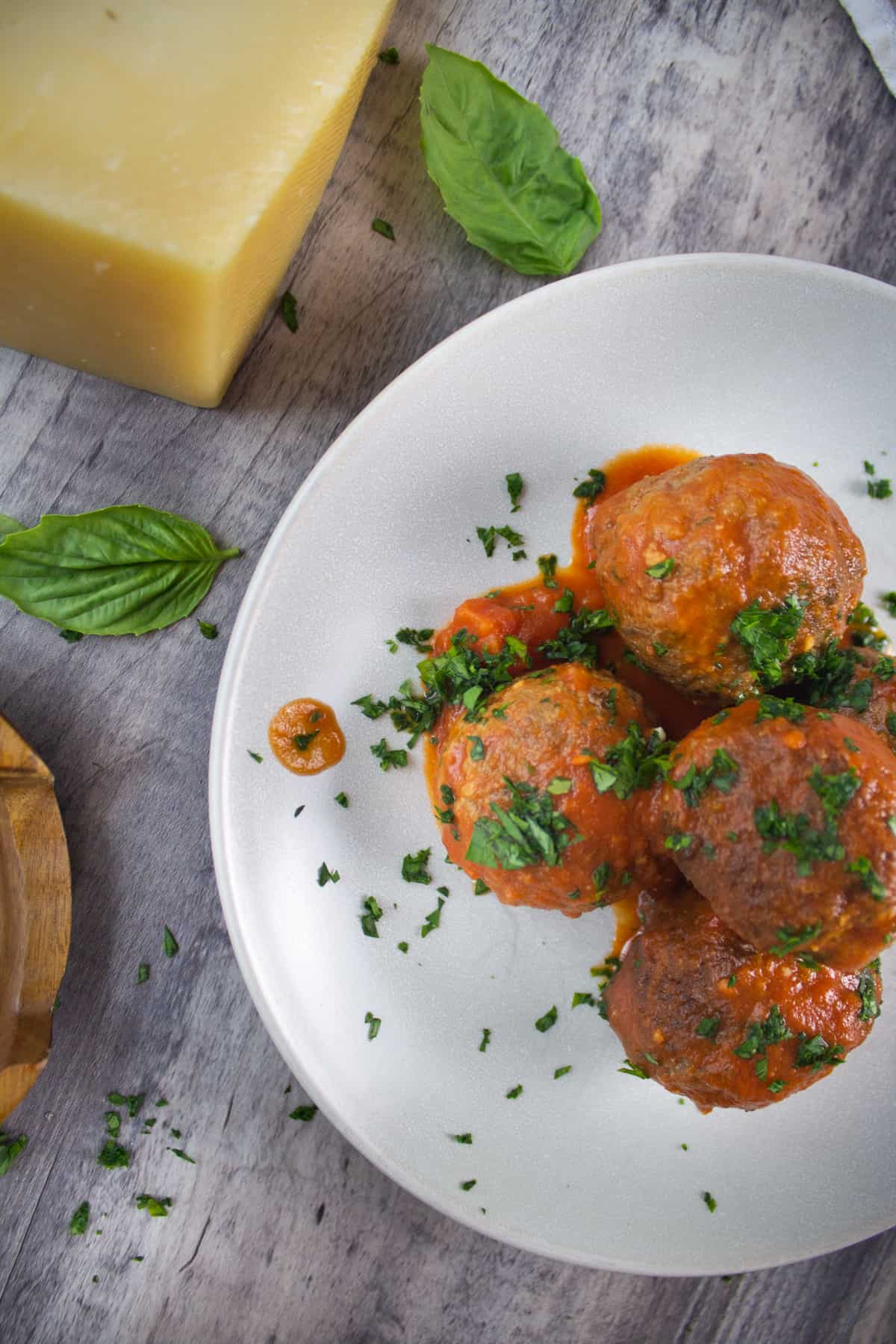 meatballs served with parmesan and fresh basil