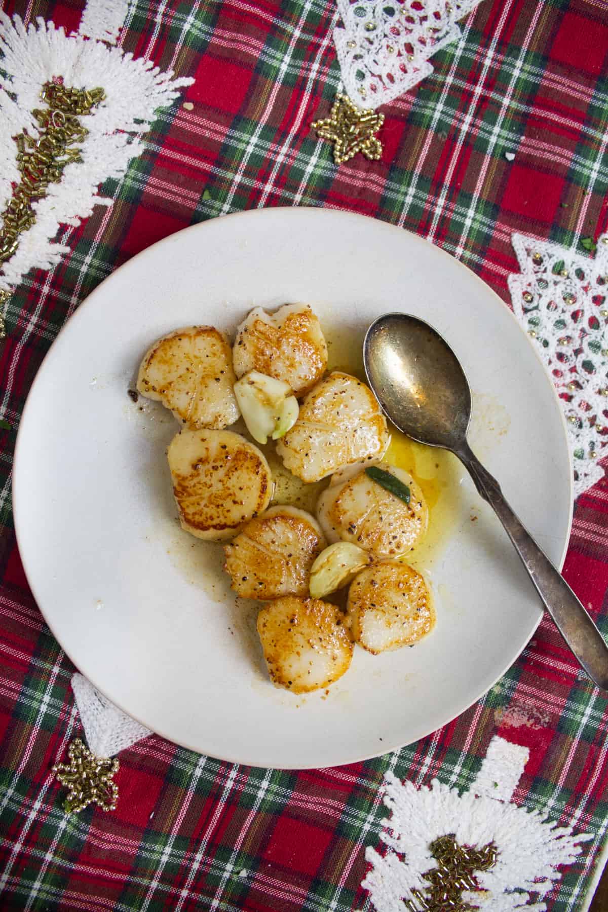 Seared scallops on a plate. 