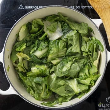 Escarole sauteing in the dutch oven.