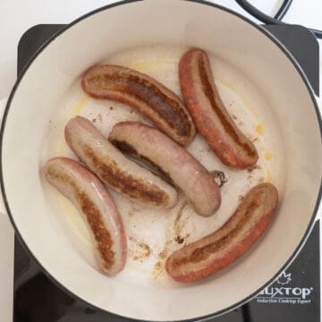 Searing sausage in the pot.