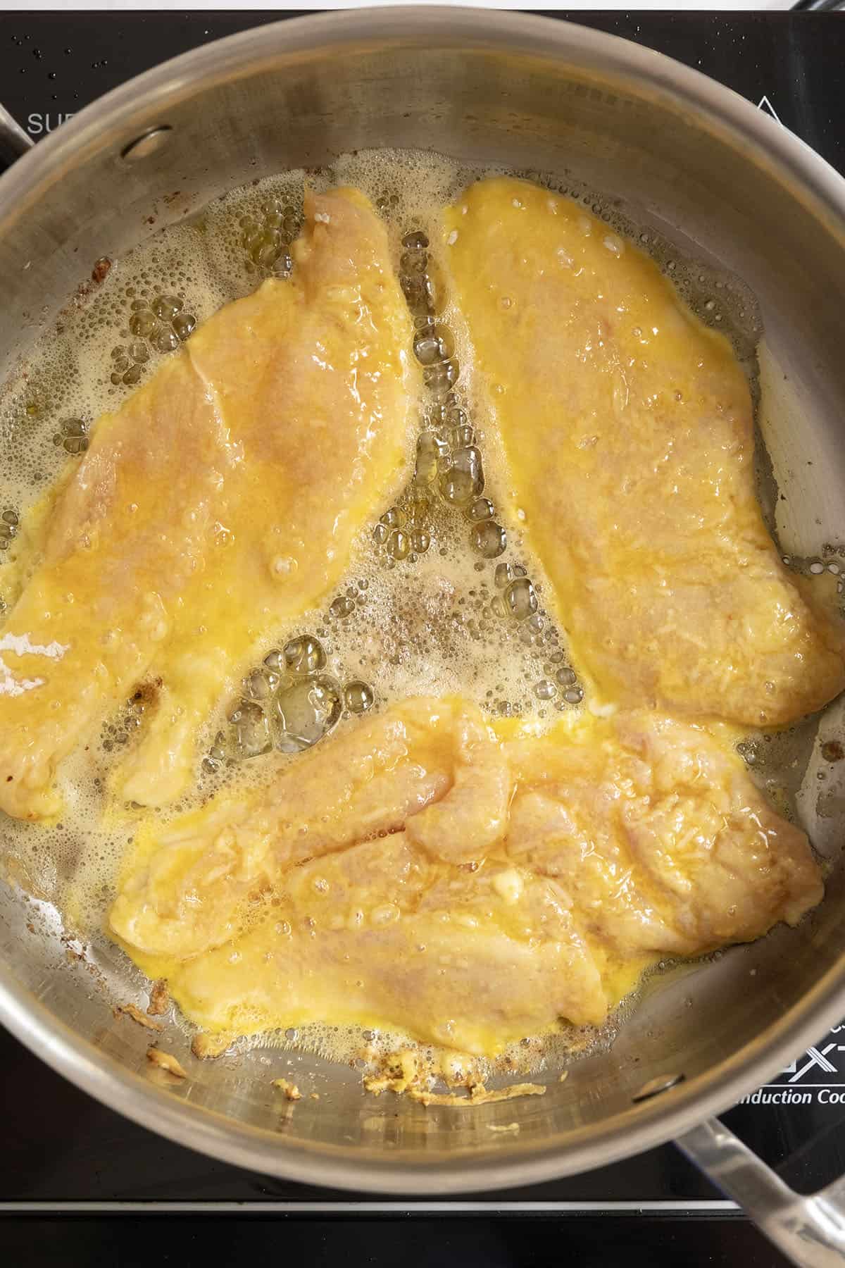 Gourmet Chicken Francese 6 Frying chicken cutlets in a large saucepan with olive oil