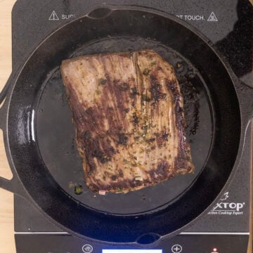 Steak seared on cast iron pan.