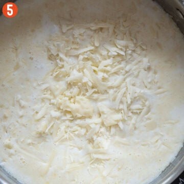 Combining 4 Italian cheeses in the pan with the roux.