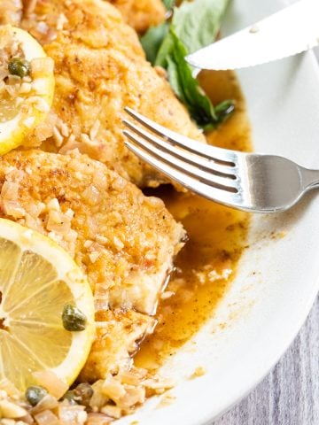 chicken francese topped with capers and lemon