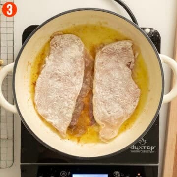 Frying chicken with prosciutto, prosciutto side down.