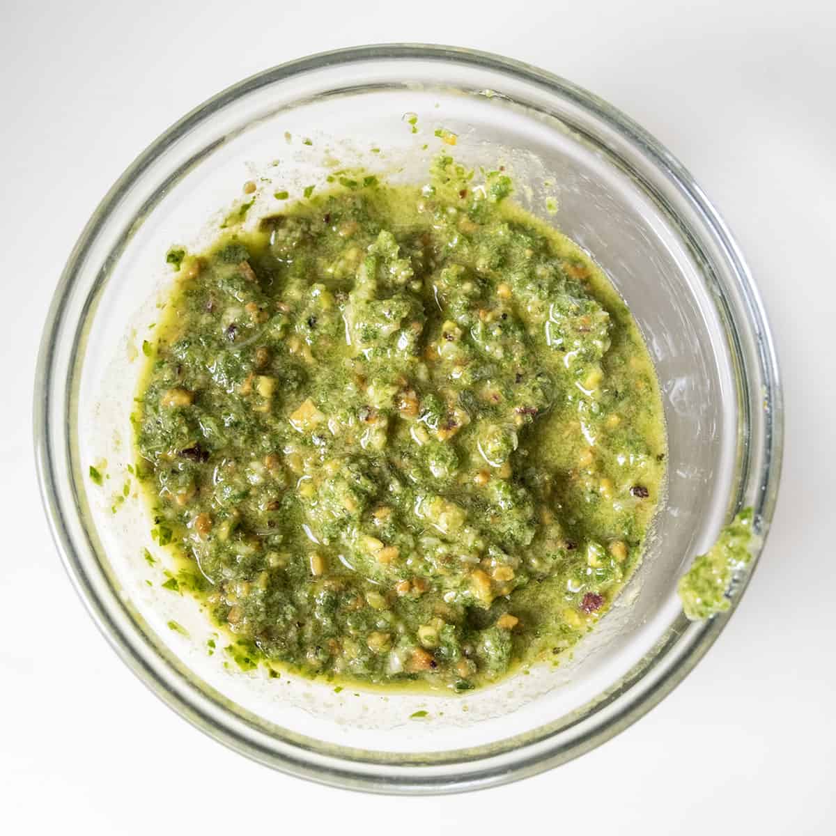 Pesto in a glass bowl.