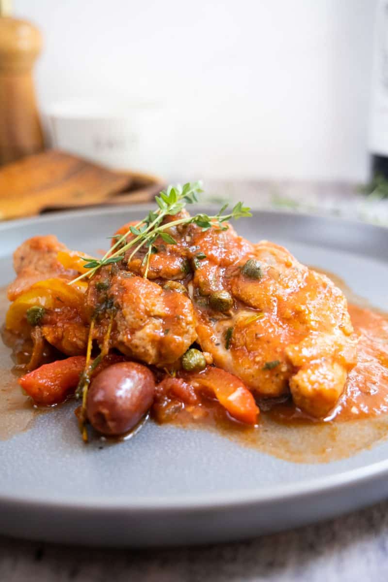 chicken cacciatore served with olives, capers, and fresh thyme