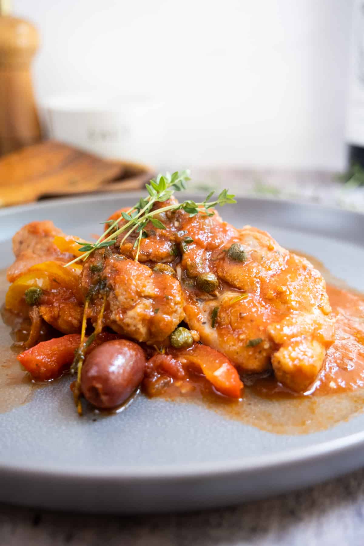 chicken cacciatore served with olives, capers, and fresh thyme
