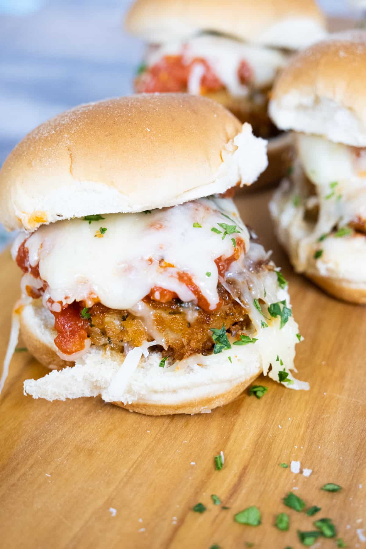 chicken parm sliders with tomato sauce and melted mozzarella