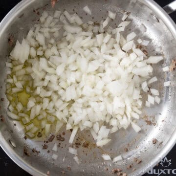 Onions sauteing in saucepan.