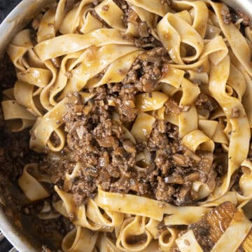 Pappardelle added to the lamb ragu.