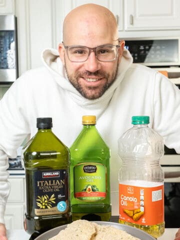 Me standing with 3 oils and chicken cutlets.