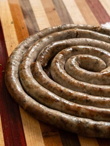 Italian ring sausage on a cutting board.