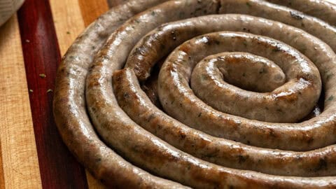 Italian ring sausage on a cutting board.