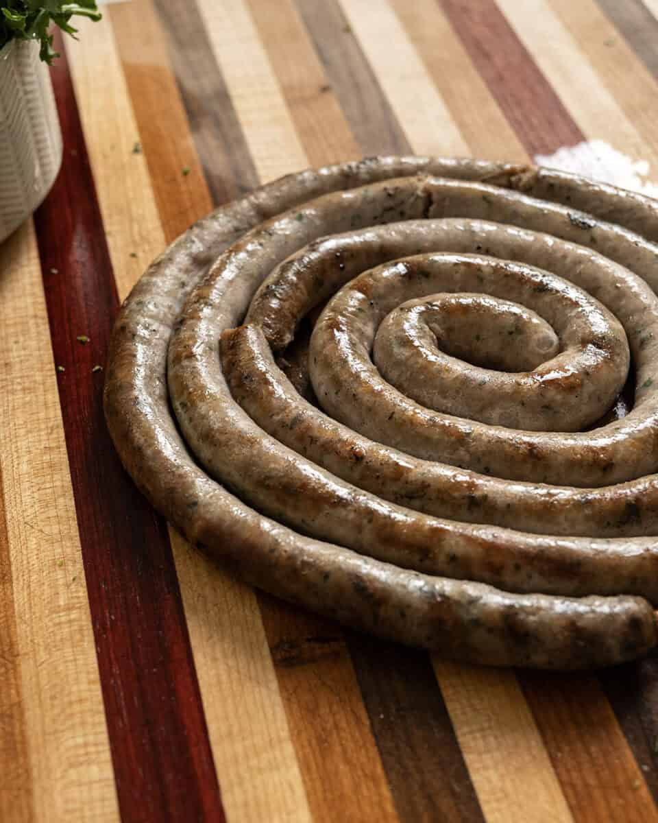 Italian ring sausage on a cutting board.