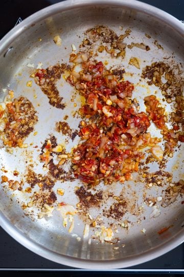 caramelizing tomato paste and calabrian chili peppers