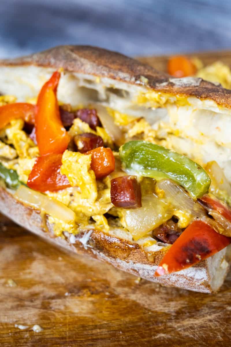 peppers and eggs sandwich topped with pancetta
