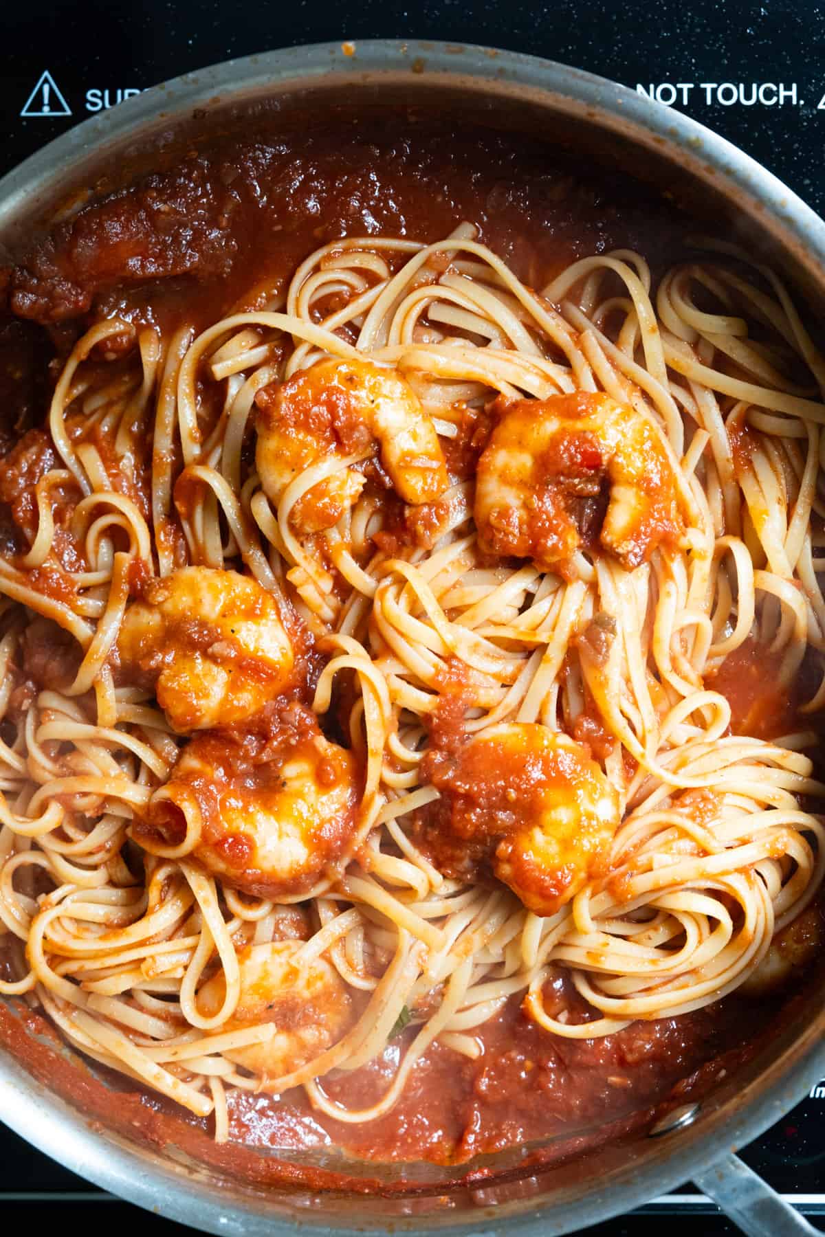 linguine combined with sauce and shrimp