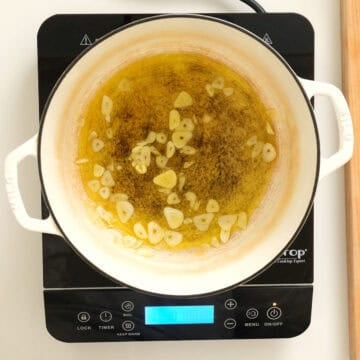 Sauteing garlic in a dutch oven.