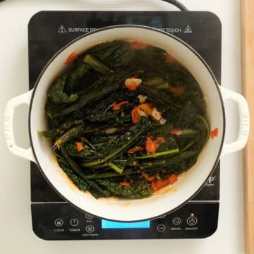 Braised lacinato kale in a dutch oven.