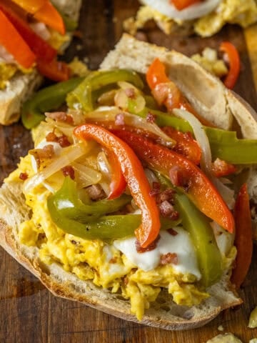 Peppers and eggs sandwich with mozzarella and pancetta on Italian Bread.