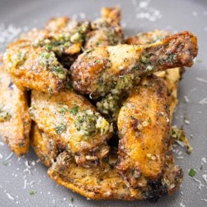 air fryer garlic parm wings piled neatly on a plate