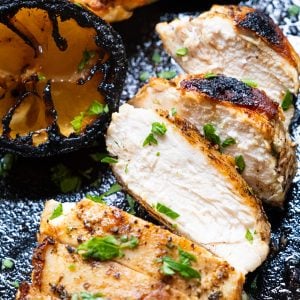 chicken breast cooked in cast iron skillet and sliced