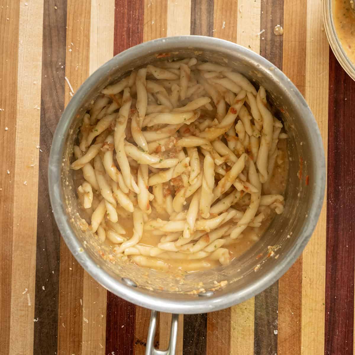 Busiate pasta in a pot with pesto trapanese.