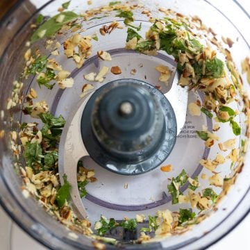 basil, almonds, and garlic processed in food processor