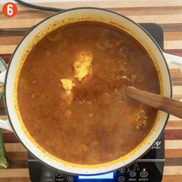 Chicken breast returned to the soup to simmer.