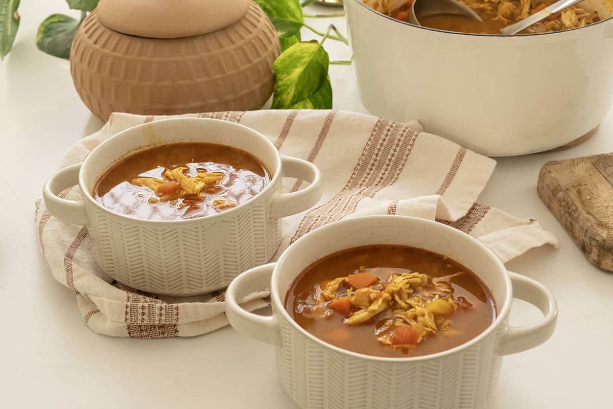 Chicken farro soup served in bowls.