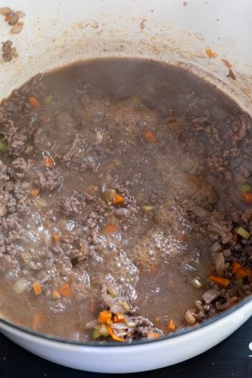 red wine simmering with ground beef