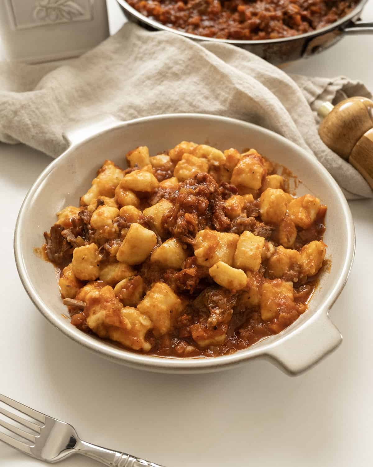 Italian short ribs in a bowl with gnocchi.