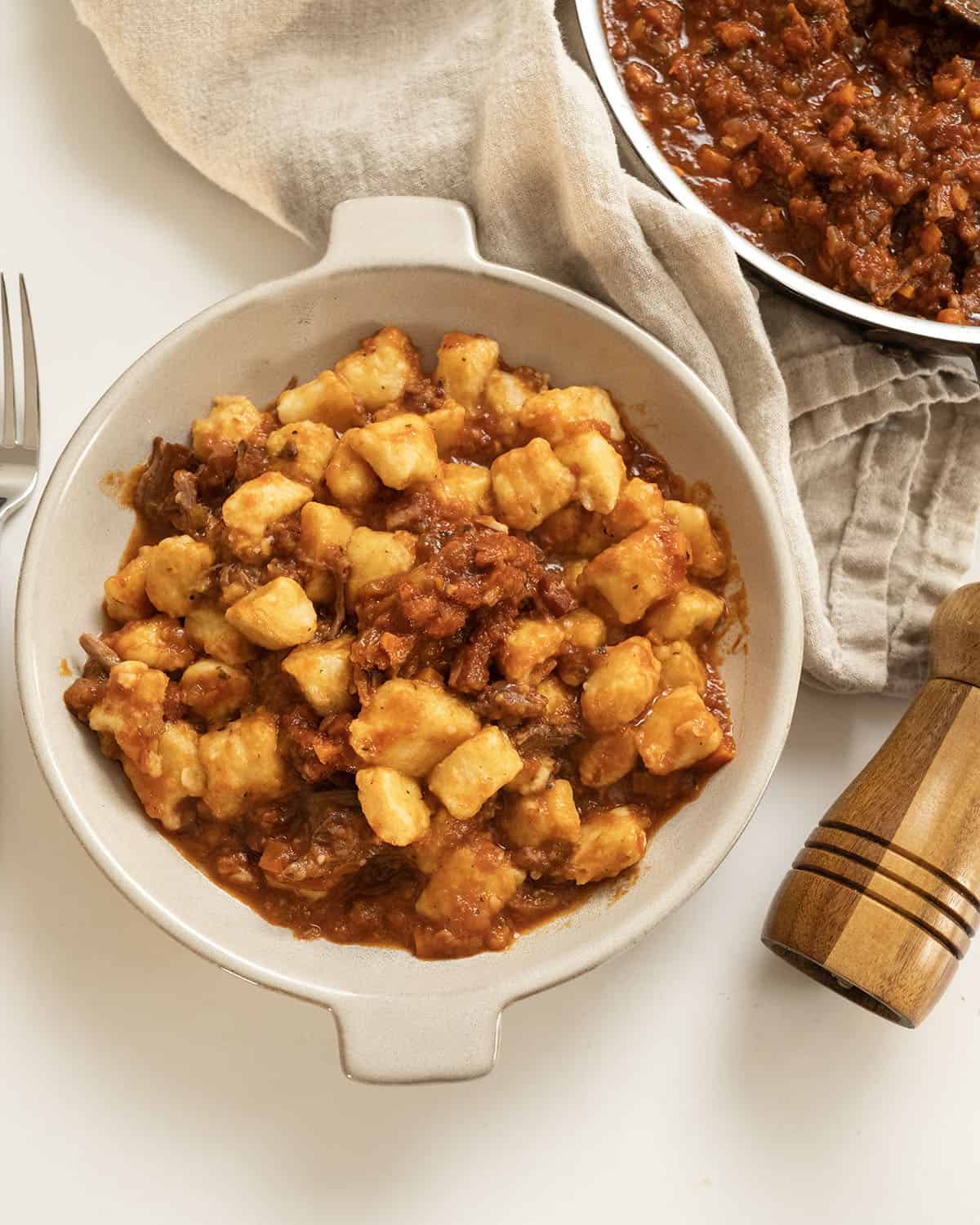 Italian short ribs in a bowl with gnocchi.