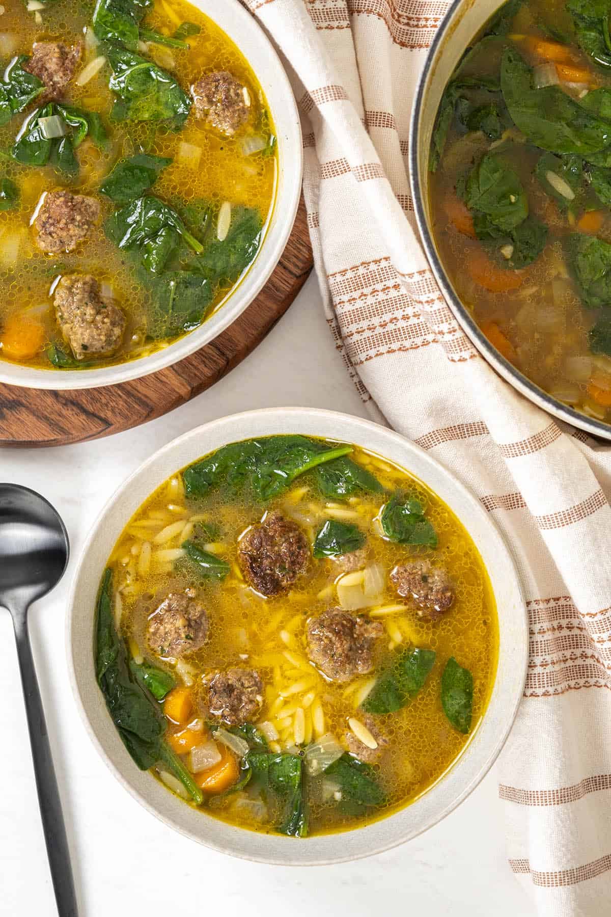 Italian wedding soup in a bowl with meatballs