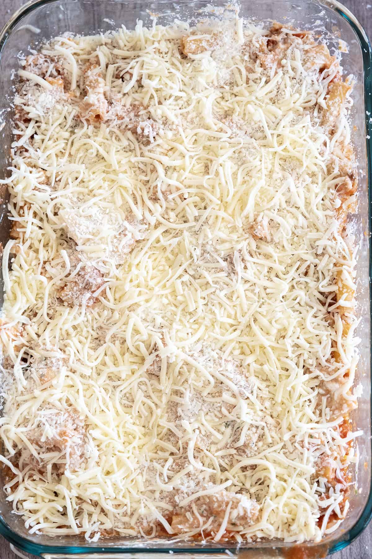 another layer of everything added to the baking dish topped with extra parmesan and mozzarella