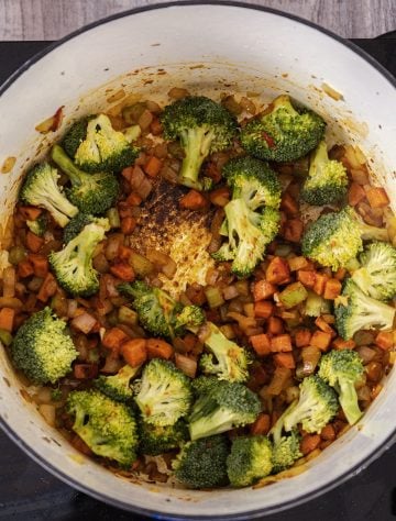 adding broccoli to slightly steam