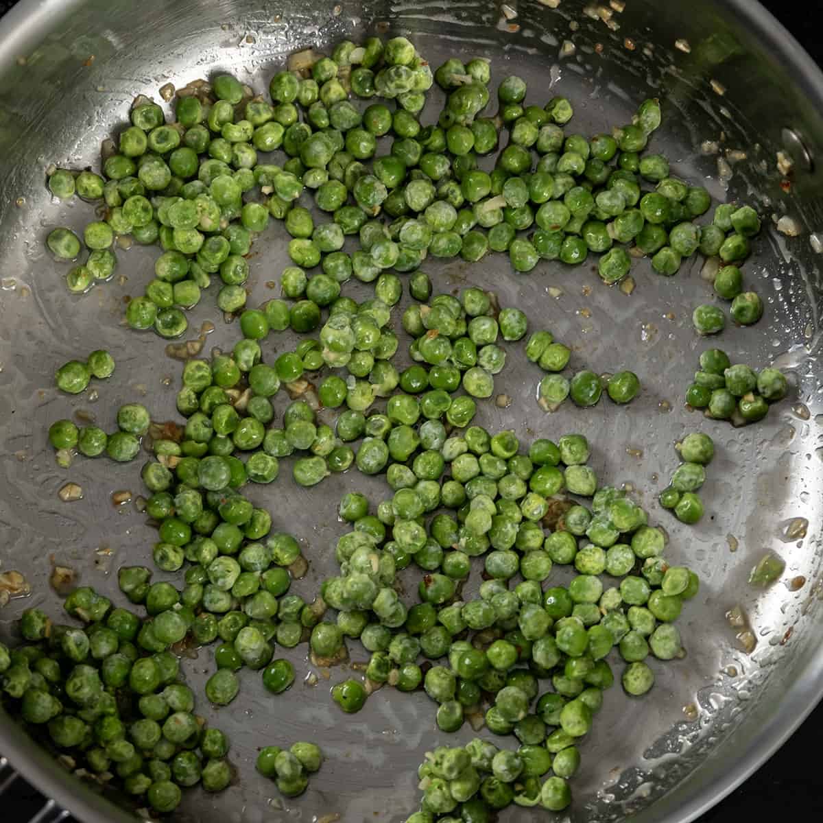 sauteing the peas