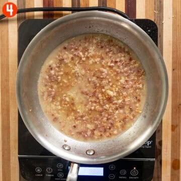Simmering pancetta and a garlic with pasta water.