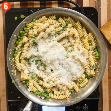 The pasta and peas tossed in cheese.