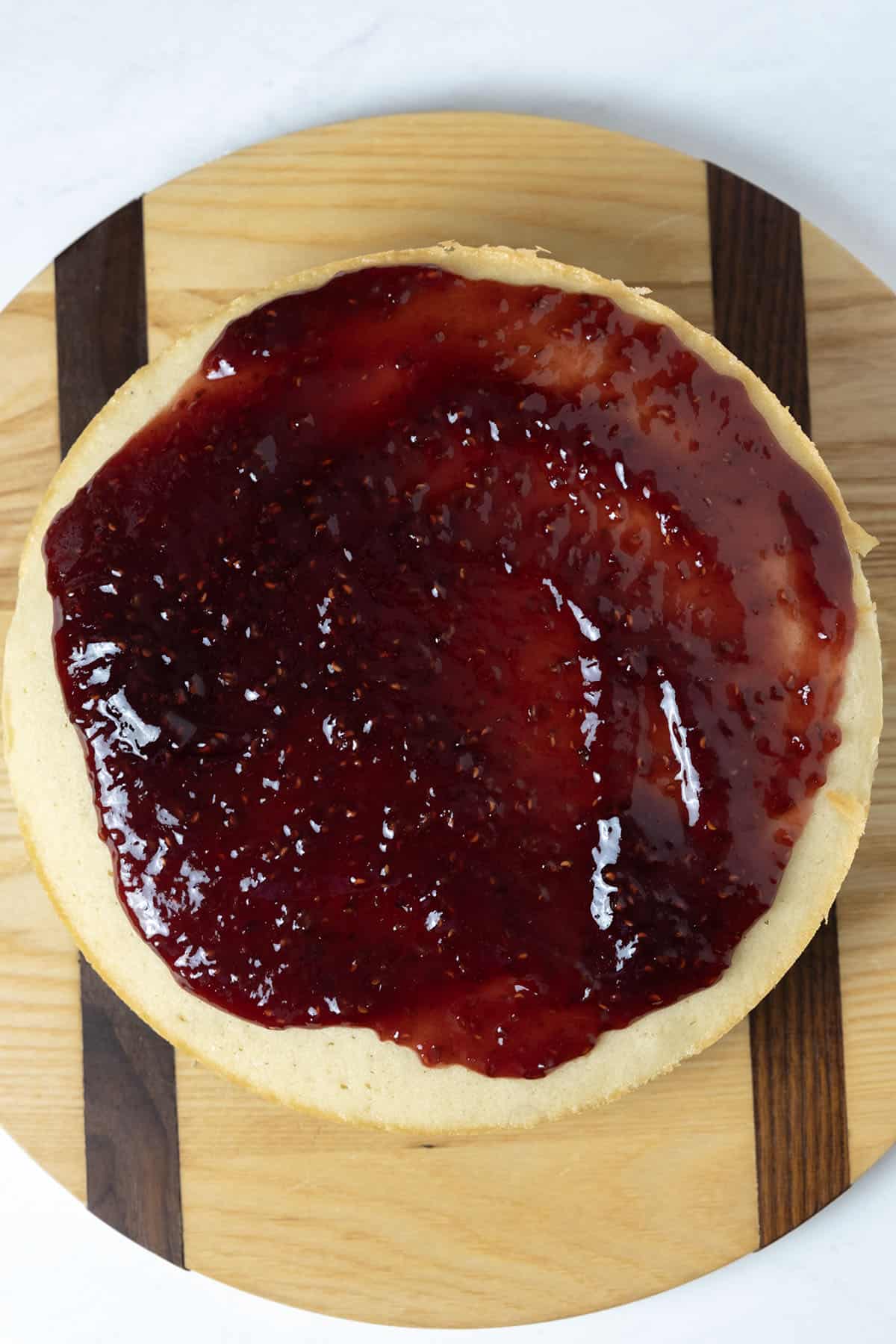 raspberry jam spread on second layer