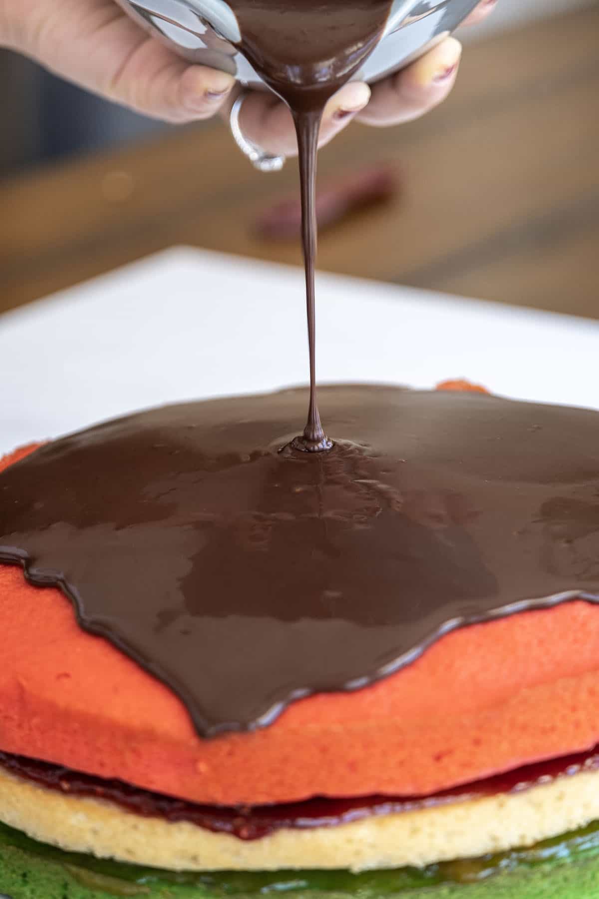 chocolate ganache spread on the cake