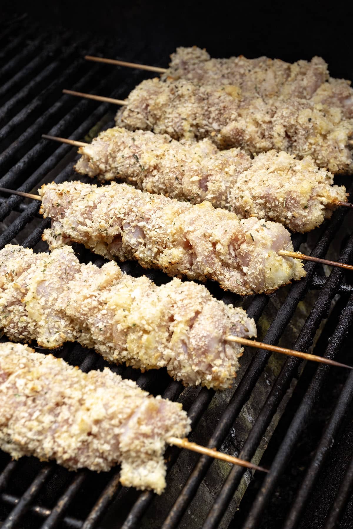 Grilling chicken skewers. 