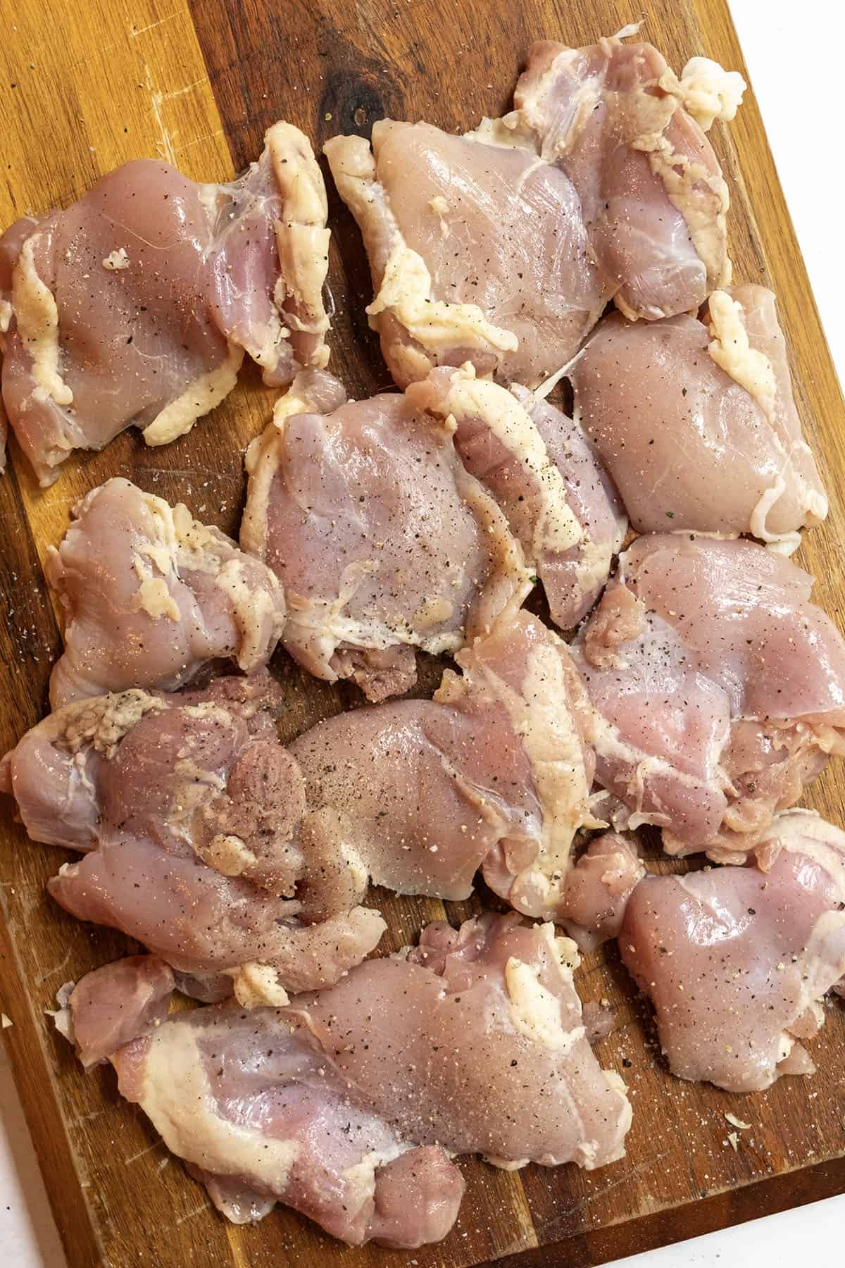 Grilled Chicken Skewers 5 Raw chicken thighs seasoned with salt and pepper.
