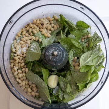 basil, garlic, and pine nuts in the blender