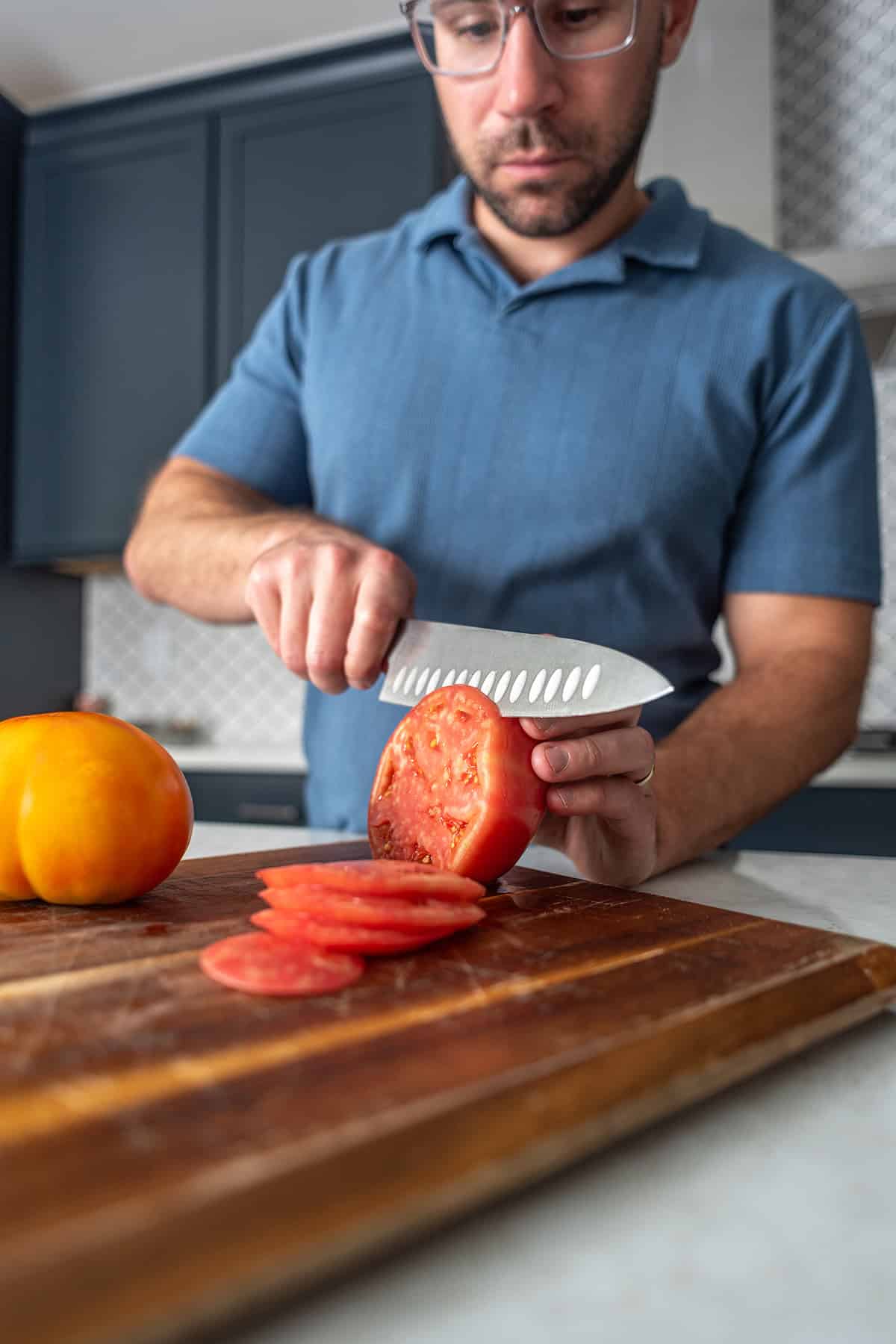 Vinny slicing tomatoes
