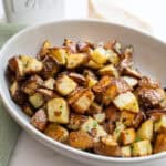 garlic parmesan potatoes in a bowl.