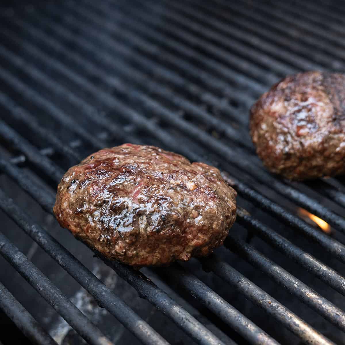 Gourmet Fig and Goat Cheese Burger 6 Burgers on the grill.